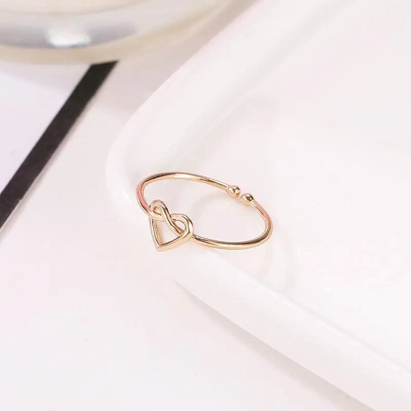 Korean version simple hollowed out heart-shaped opening adjustable ring with infinite love, peach heart tail ring, hand jewelry